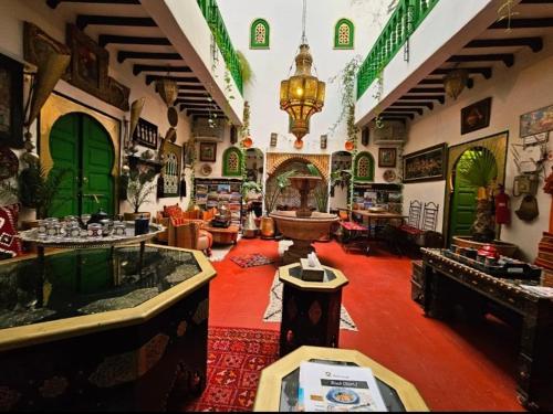 a room with a large room with a large room with a room at riad cherif in Marrakech