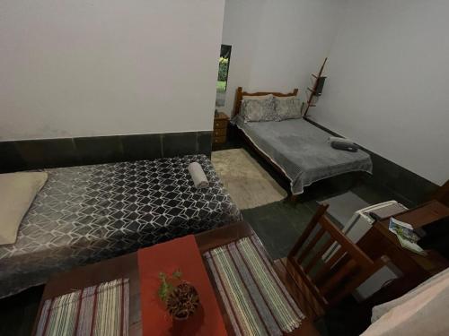 Ένα ή περισσότερα κρεβάτια σε δωμάτιο στο Espaço Riacho