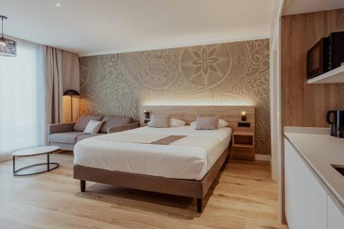 Ένα ή περισσότερα κρεβάτια σε δωμάτιο στο Hotel Reva TAHITI