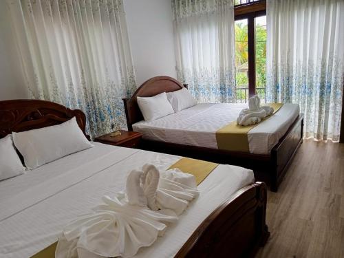 Ένα ή περισσότερα κρεβάτια σε δωμάτιο στο Cozy Modern Home in Thalawathugoda - Midtown Trace Stay