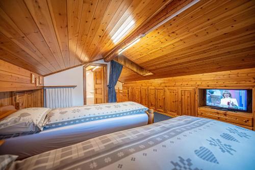 Ένα ή περισσότερα κρεβάτια σε δωμάτιο στο Chalet Edera Myholidaylivigno