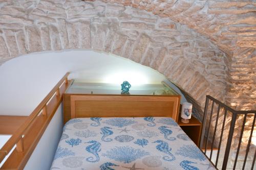 En eller flere senge i et værelse på Dimora Marina