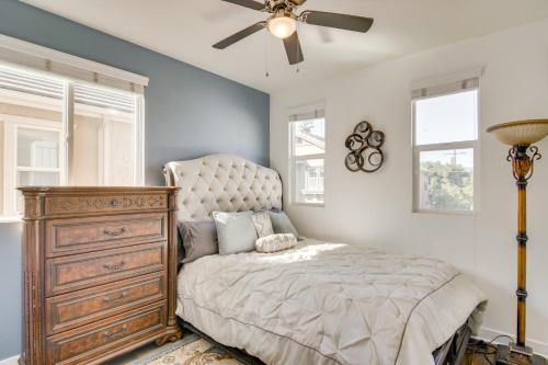 a bedroom with a bed with a dresser and a ceiling fan at Home Theater System and Gazebo Los Angeles Getaway! in San Fernando