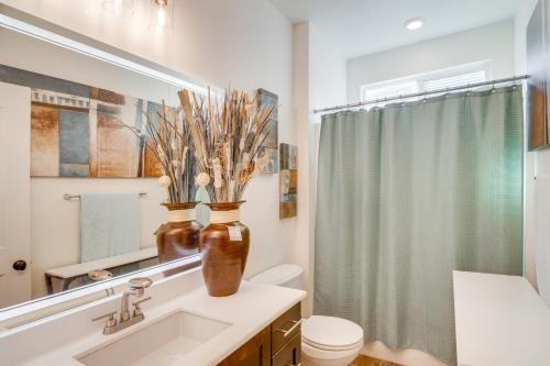 a bathroom with a sink and a mirror at Home Theater System and Gazebo Los Angeles Getaway! in San Fernando