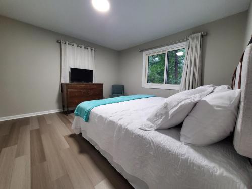 Postel nebo postele na pokoji v ubytování Jurney Home