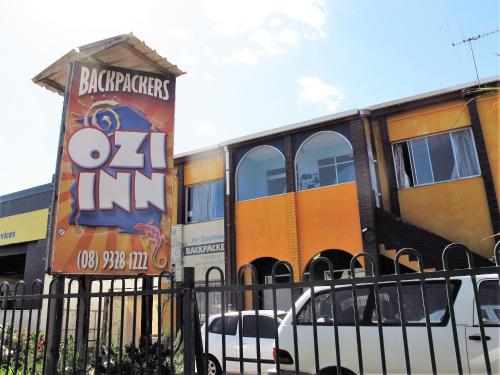 a train car parked in front of a building at Ozi Inn Backpackers - Perth -Valid International Passport Required in Perth