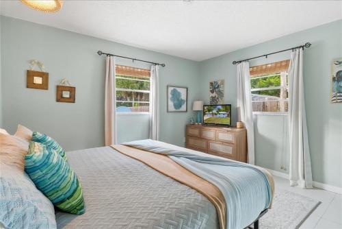 a bedroom with a bed and a television in it at Crystal Blue Haven in Crystal River