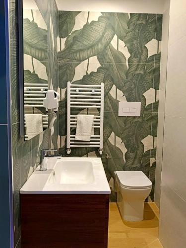 a bathroom with a sink and a toilet at Marilù Accoglienza del Sud in Foggia