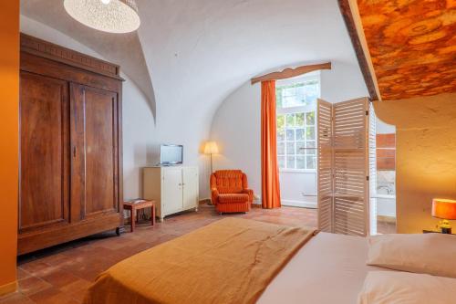 En eller flere senge i et værelse på Gite le Parc