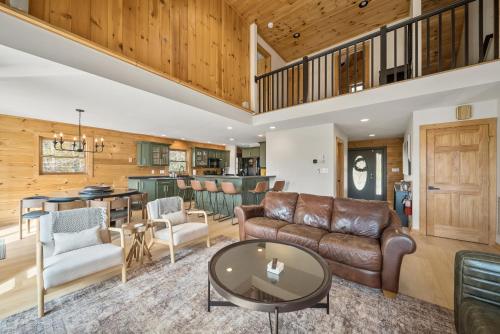 a living room with a couch and a table at Sugar View Chalet in Banner Elk