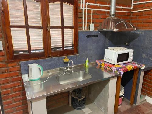 Kuchyň nebo kuchyňský kout v ubytování Apartamentos Quintana