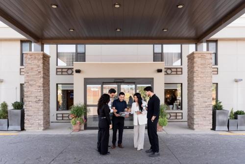 a group of people standing outside of a building at Holiday Inn Express Hotel & Suites Charlottetown by IHG in Charlottetown