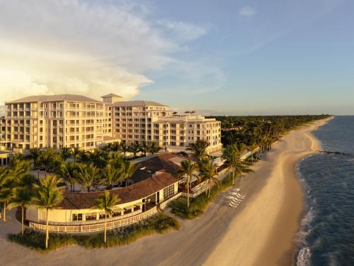 an aerial view of a resort on the beach at Naples Beach Club, A Four Seasons Resort in Naples