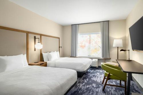 Una cama o camas en una habitación de Fairfield by Marriott Inn & Suites San Antonio Medical Center