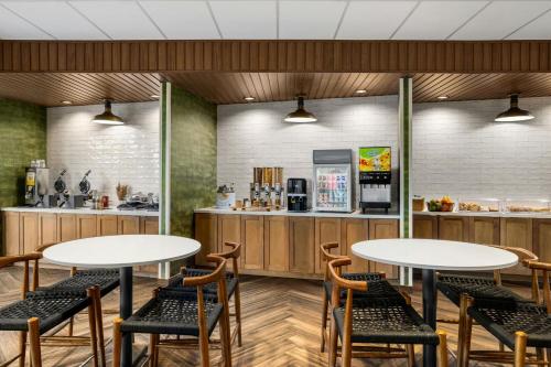 a restaurant with two tables and chairs and a kitchen at Fairfield by Marriott Inn & Suites San Antonio Medical Center in San Antonio