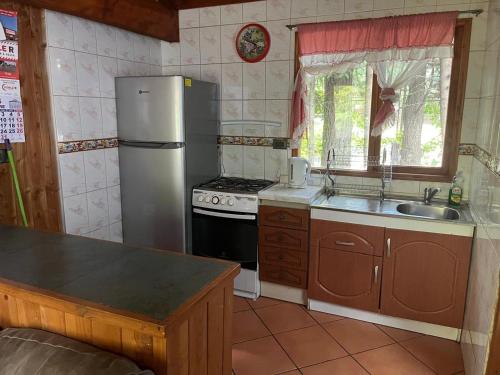 Kuchyň nebo kuchyňský kout v ubytování cabañas walls 1