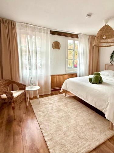 Ένα ή περισσότερα κρεβάτια σε δωμάτιο στο Maison am Fluss