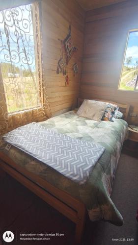 Postel nebo postele na pokoji v ubytování Hospedaje Familiar Refugio Coihuin