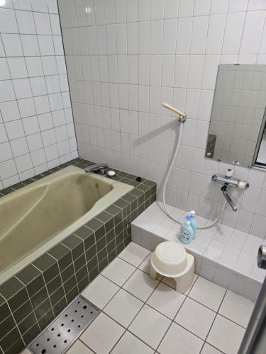 Koupelna v ubytování business hotel furusatoビジネスホテルふるさと