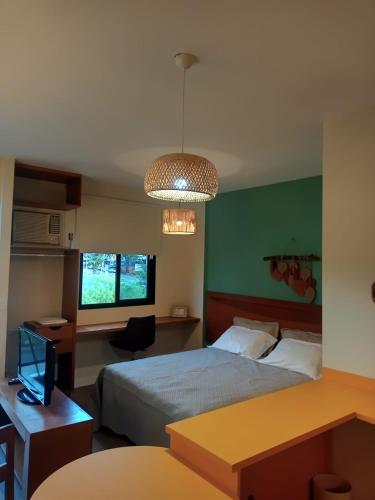 En eller flere senge i et værelse på Flat Montese Tower Resende - Refúgio na Serra da Mantiqueira, Próximo à AMAN e Penedo