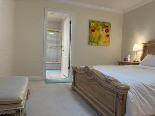 a bedroom with a bed and a painting on the wall at Cozy home in Richmond