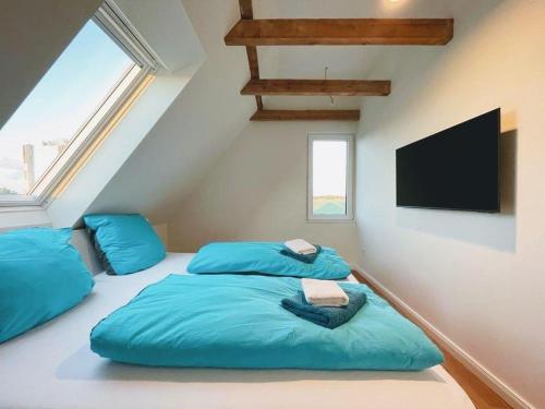 Ένα ή περισσότερα κρεβάτια σε δωμάτιο στο Ferienwohnung-Friesenblick