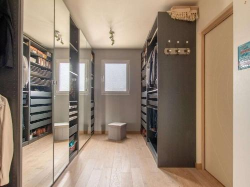 a walk in closet with a large glass door at DUXCAAR Mervent in Mervent