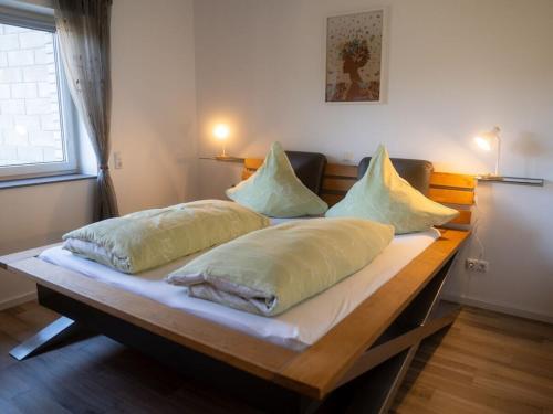 three pillows on a table in a room at Apartment with 1 bedroom in Einruhr