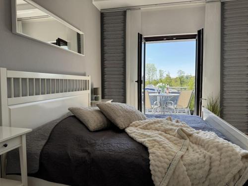 Кровать или кровати в номере Holiday apartment with 1 bedroom