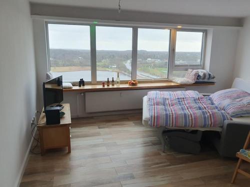 En eller flere senge i et værelse på Apartment in Schleswig with swimming pool