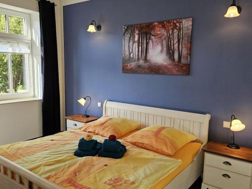 a bedroom with two teddy bears sitting on a bed at Manor house apartment in Barlin
