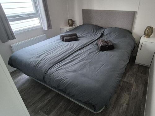 En eller flere senge i et værelse på The Veluwse Forest Cottage