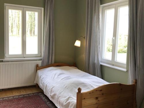 Ένα ή περισσότερα κρεβάτια σε δωμάτιο στο Holiday home on Lake Ruppin