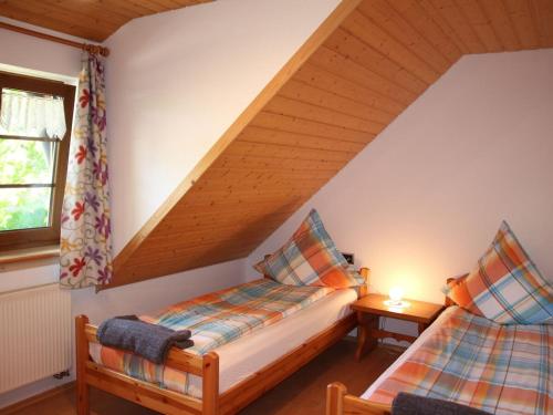 Giường trong phòng chung tại Willmannshof holiday apartment Barn Nest