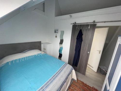 En eller flere senge i et værelse på Maison de Vacances Nieuwpoort