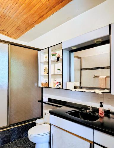 a bathroom with a sink and a toilet at Finca El Paraíso in La Mesa