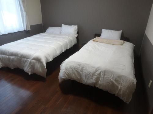 Postel nebo postele na pokoji v ubytování 愛灯-ｉｔｏ-