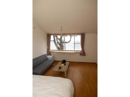 Postel nebo postele na pokoji v ubytování Beach Front Litore Iritahama - Vacation STAY 76446v