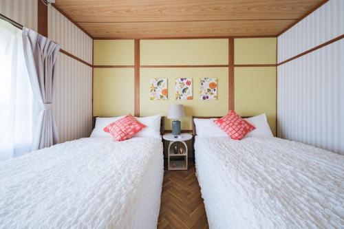 En eller flere senge i et værelse på Sen no Yado Nagashima Nagoya