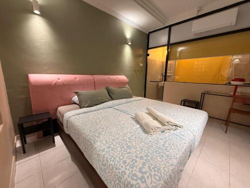 Ένα ή περισσότερα κρεβάτια σε δωμάτιο στο Capy House Taiping