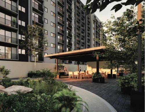 a courtyard with tables and chairs in a building at New apartment near H. Civil Viejo with A/C in Guadalajara