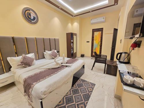 a bedroom with a large bed in a room at prabh aasra in Ayodhya
