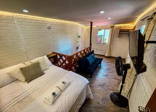 En eller flere senge i et værelse på APARTAMENTO MINCA SUITE In