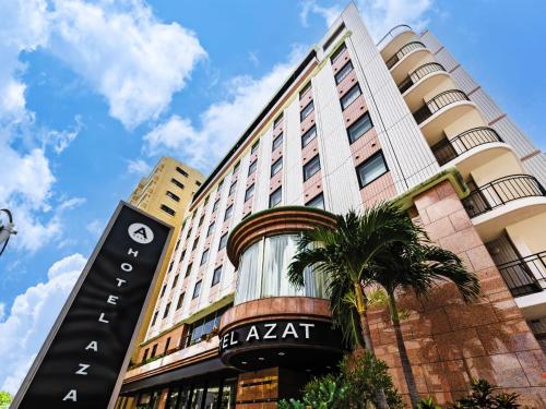 a building with a sign in front of it at Hotel Azat Naha in Naha