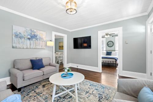 a living room with a couch and a table at Hay House- Adorable and updated home! in Fayetteville