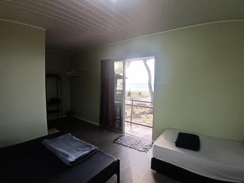 En eller flere senge i et værelse på KBH Guest House