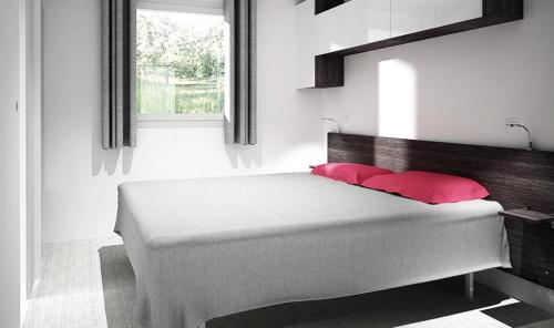 Кровать или кровати в номере Camping 4 étoiles - Piscine - eecaad