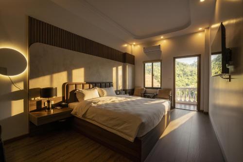 En eller flere senge i et værelse på Odyssey Hotel 2, Tours & Motorbikes Rental