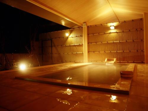 an empty dance floor at night with lights at Sakaeya Hotel in Tendo