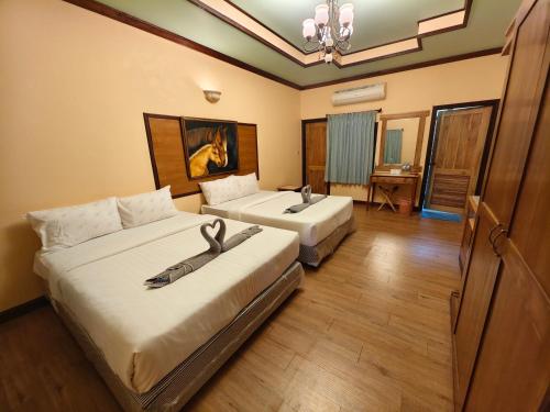 Postel nebo postele na pokoji v ubytování เขาใหญ่ฮาร์ทแลนด์ khaoyai heartland